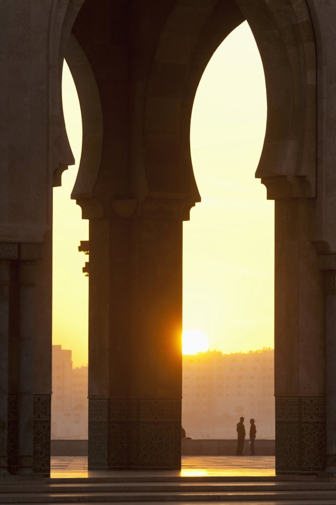Morocco Looking through arches of Hassan II mosque to couple chatting Casablanca Canvas Art - Ian Cumming Design Pics (24 x 38)