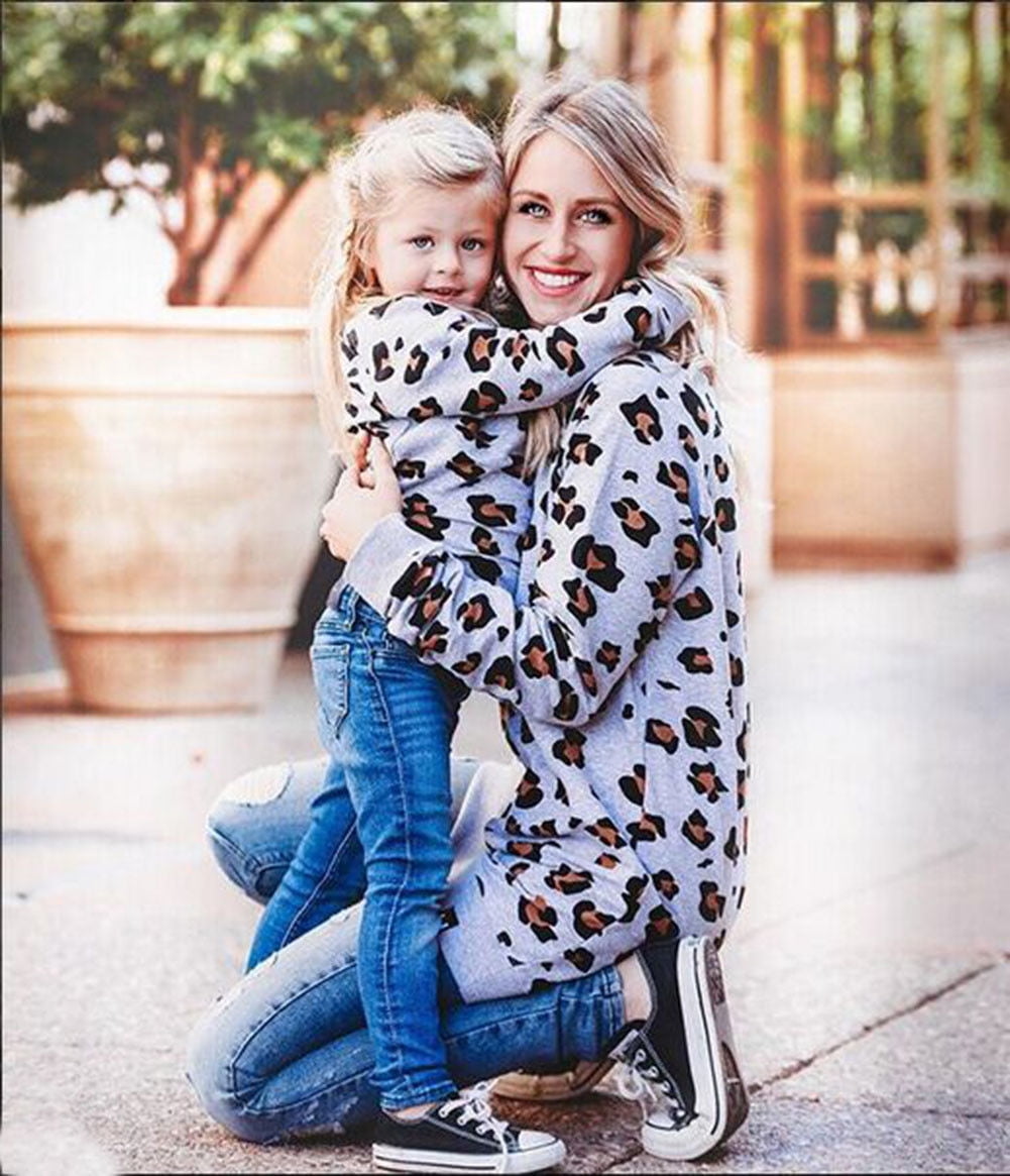 Mother and daughter store matching leopard outfits