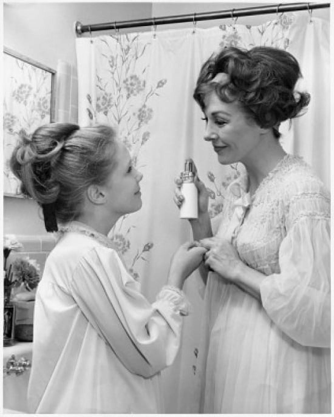 Mother about to spray perfume on her daughter Canvas Art - (24 x 36)