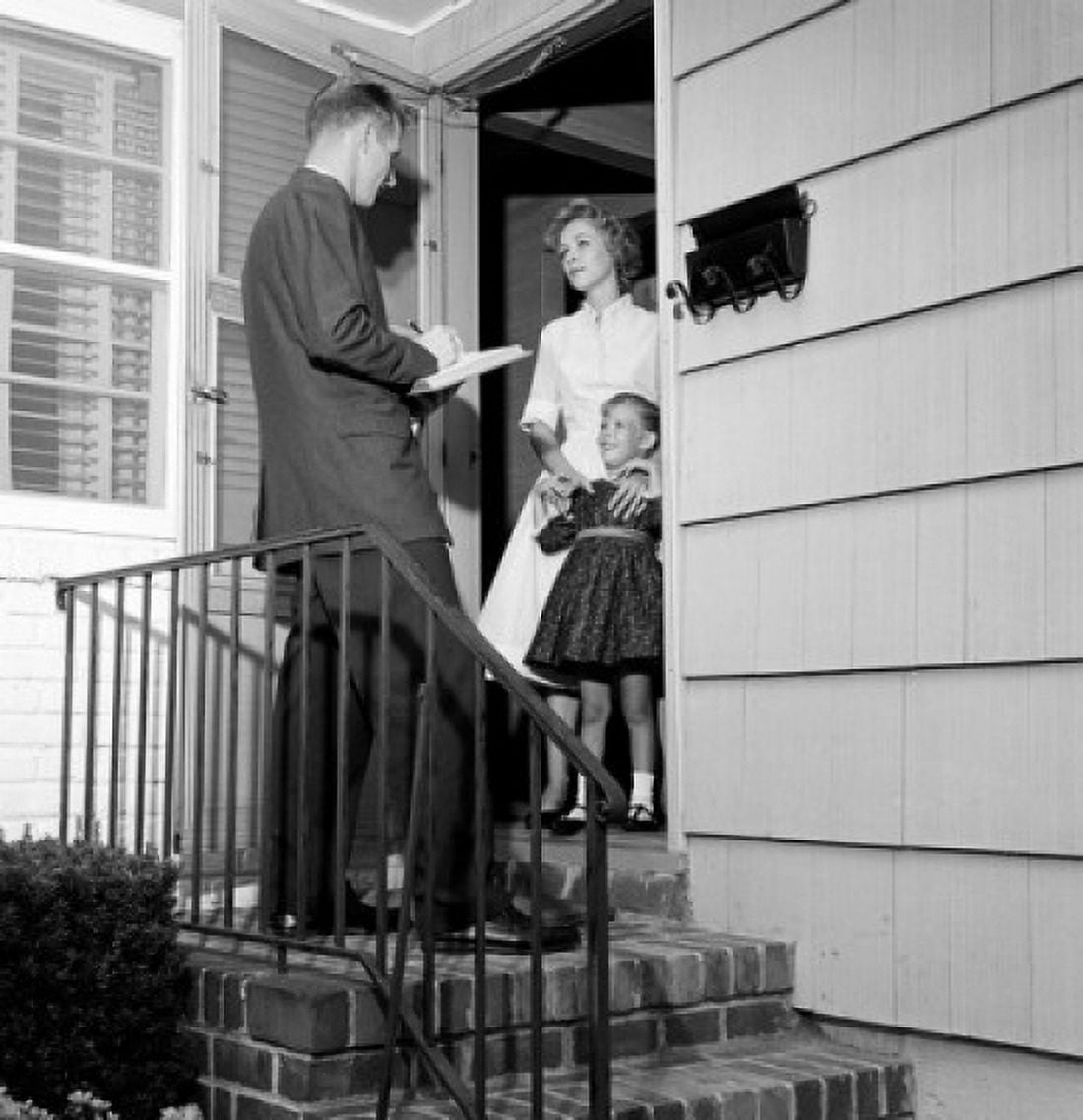 Mother and daughter answering pollsters questions in doorway Canvas Art - (18 x 24)