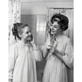thumbnail image 1 of Mother and daughter applying moisturizer on their cheeks Poster Print (18 x 24), 1 of 4