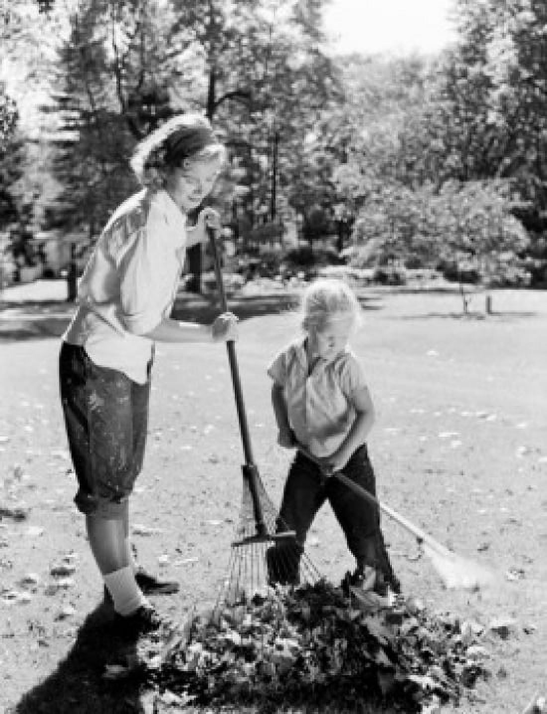 Mother and daughter cleaning leaves Canvas Art - (24 x 36)