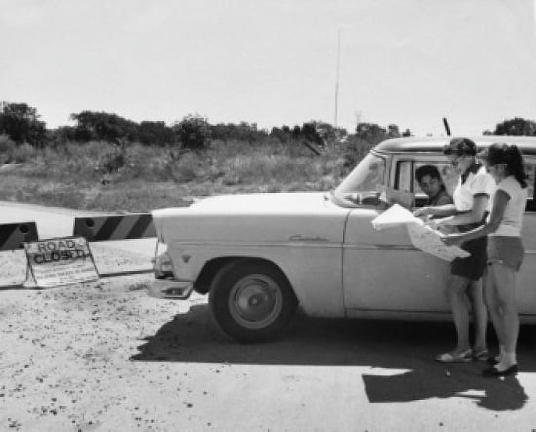 Mother and daughter looking at map near closed road sign Canvas Art - (24 x 36)