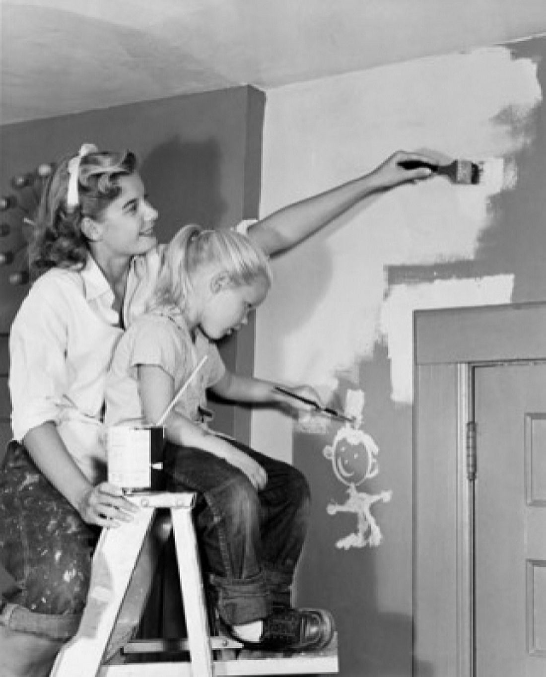 Mother and daughter painting wall at home Canvas Art - (24 x 36)