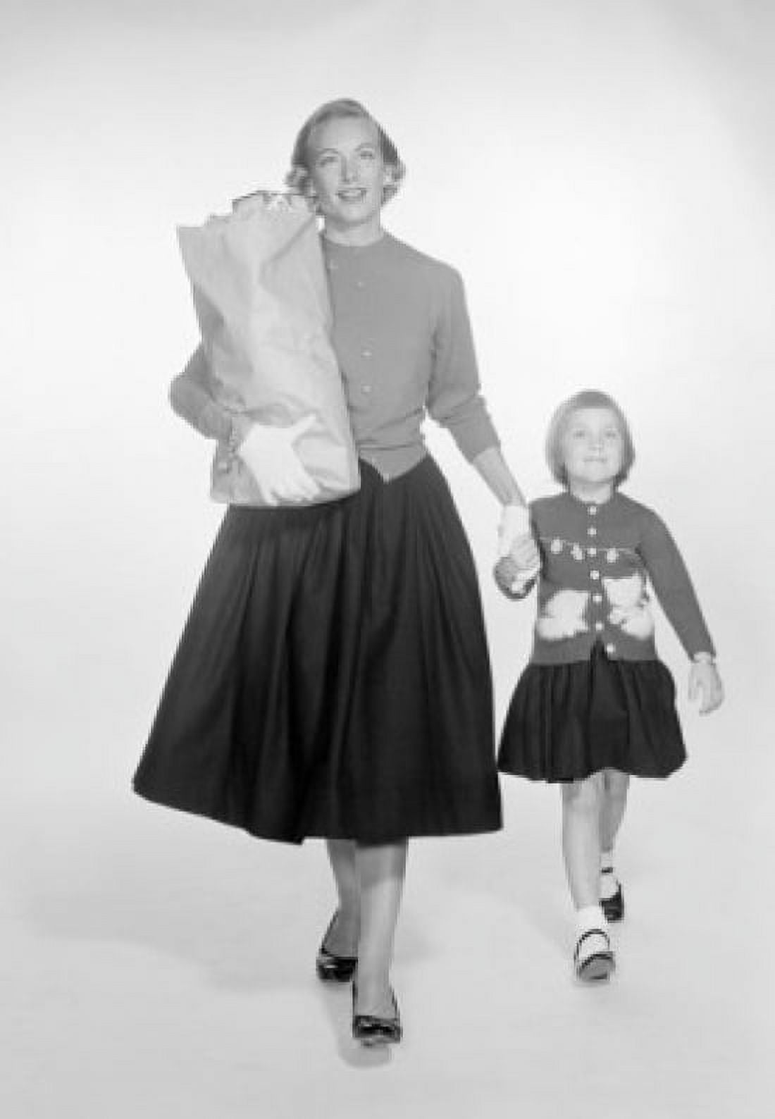 Mother and daughter walking and carrying shopping bag Canvas Art - (24 x 36)