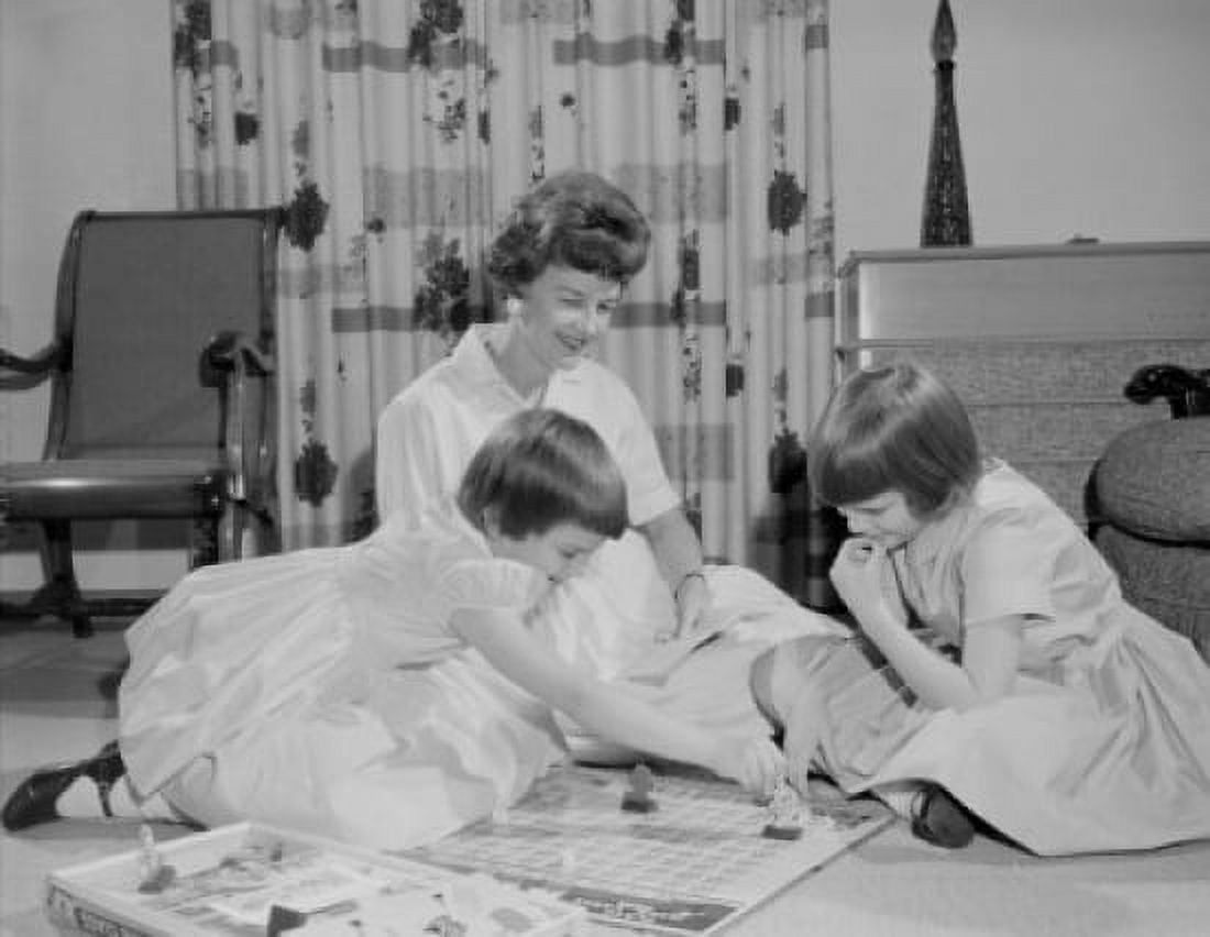 Mother and daughters playing game on living room floor Canvas Art - (18 x 24)