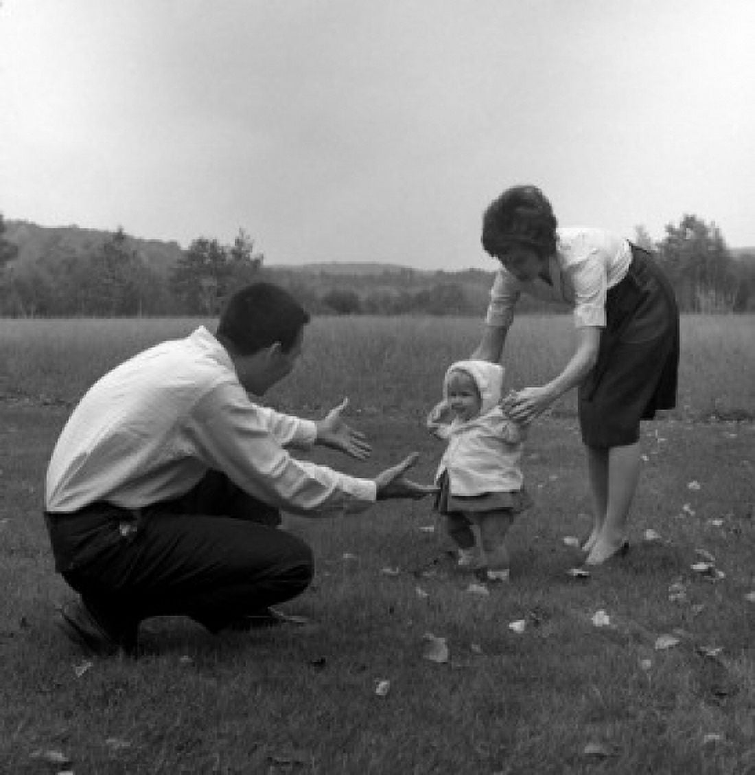 Mother and father learning baby girl how to walk Canvas Art - (18 x 24)