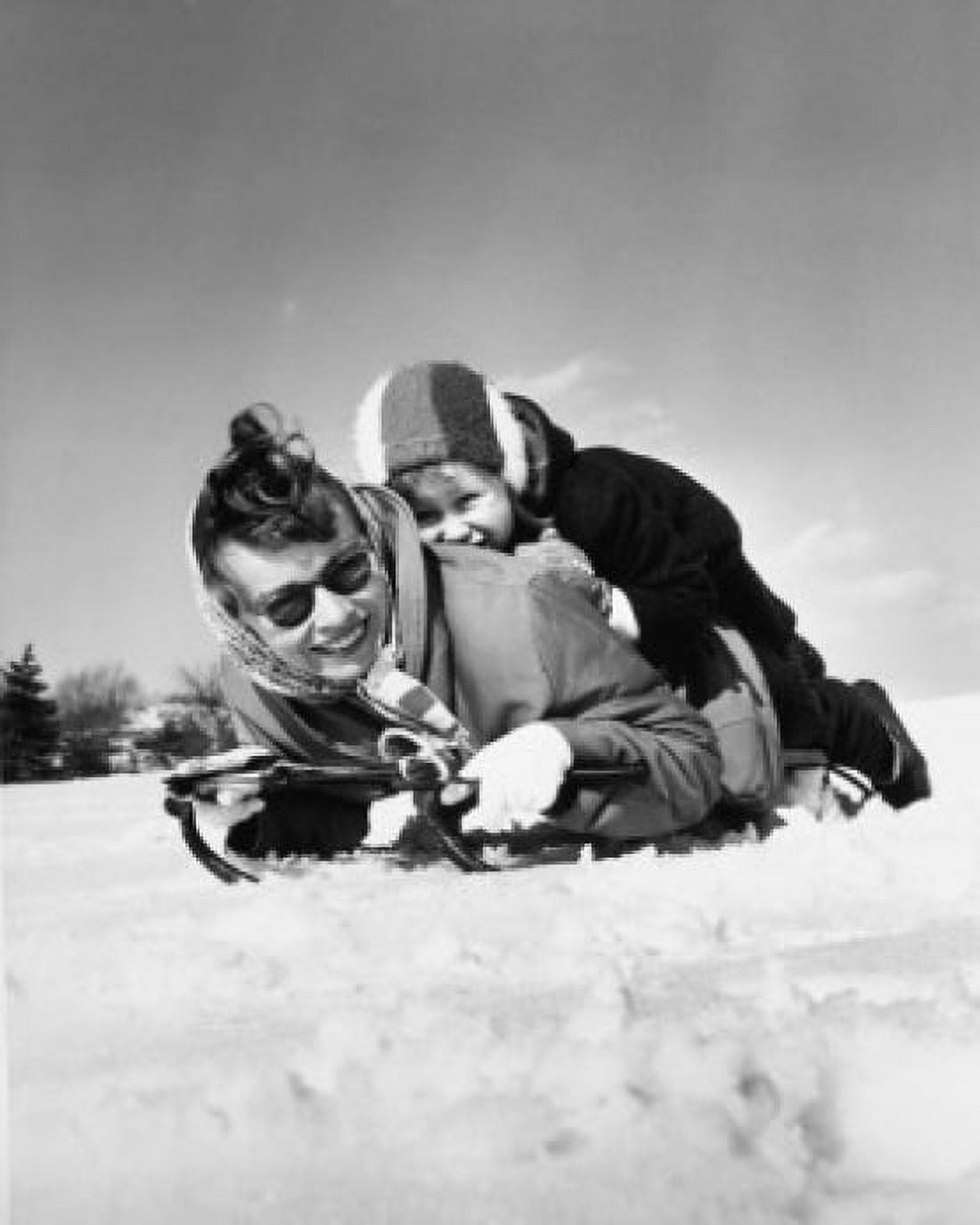 Mother and her daughter riding on a sled Canvas Art - (24 x 36)