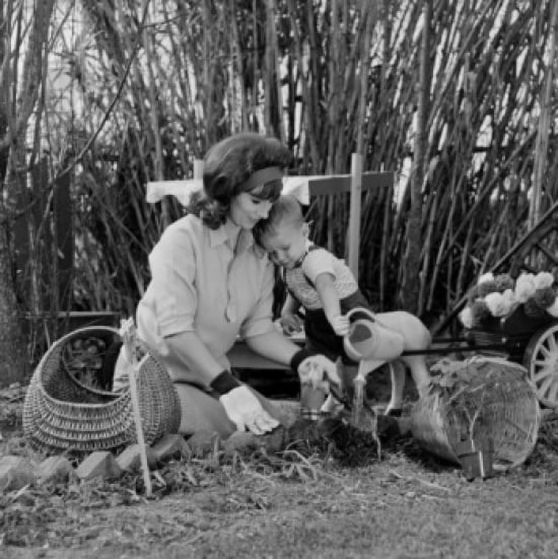 Mother and son planting in garden Canvas Art - (18 x 24)