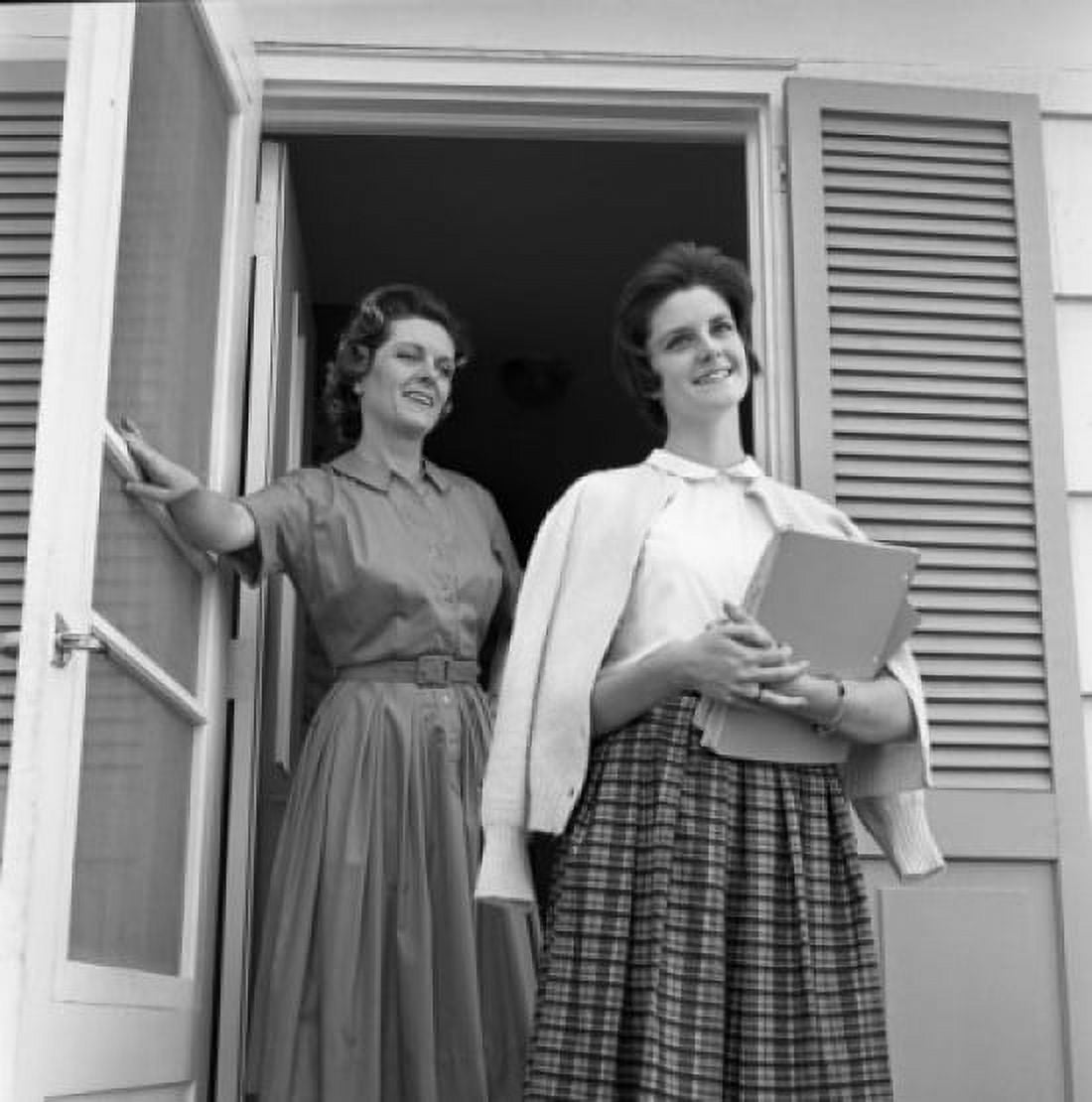 Mother and teenage daughter standing in front of house Canvas Art - (24 x 36)