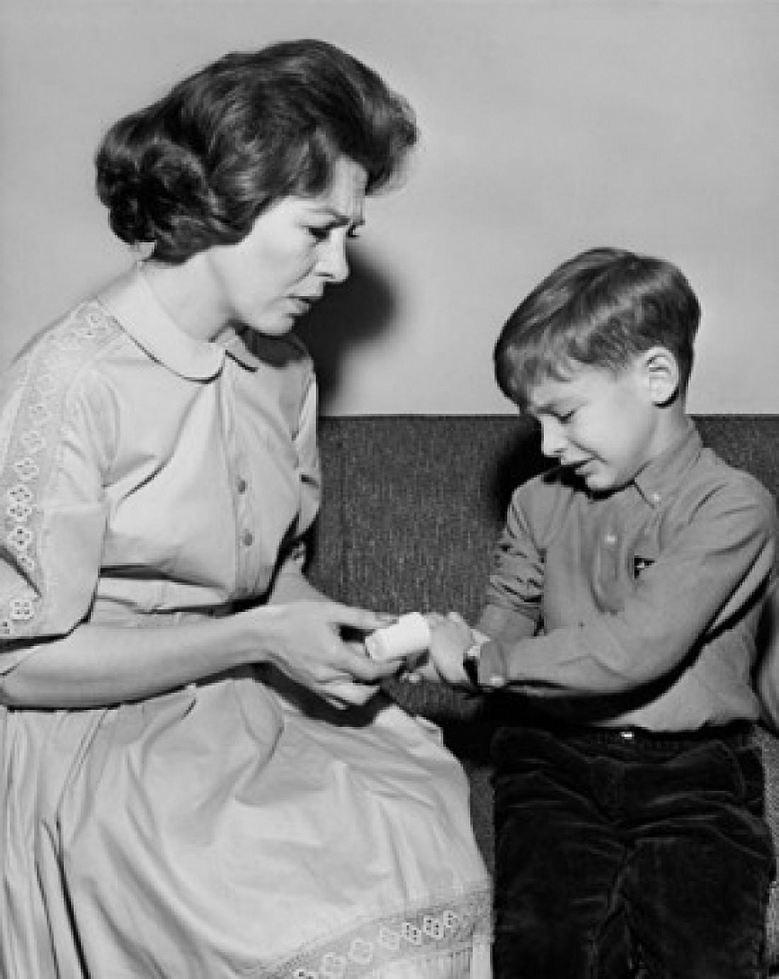 Mother applying a bandage on her son Canvas Art - (18 x 24)