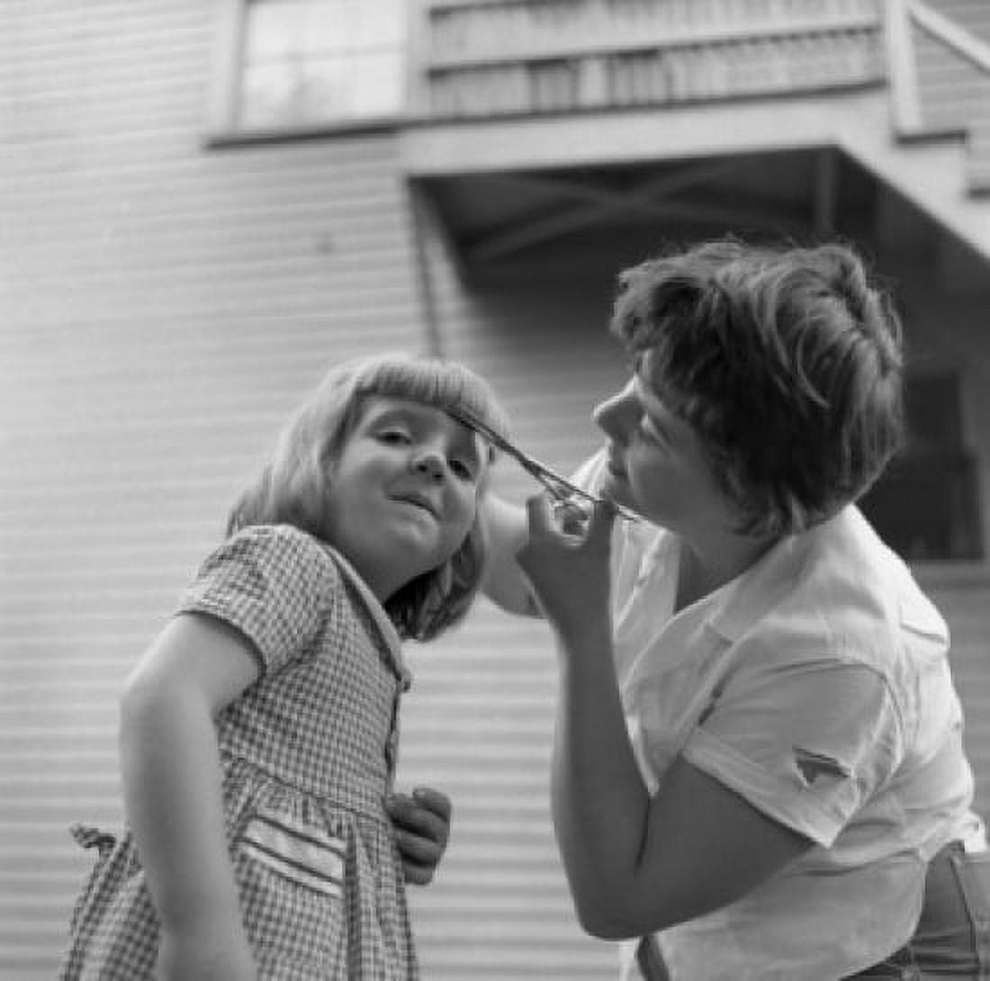 Mother cutting daughters fringe Canvas Art - (24 x 36)