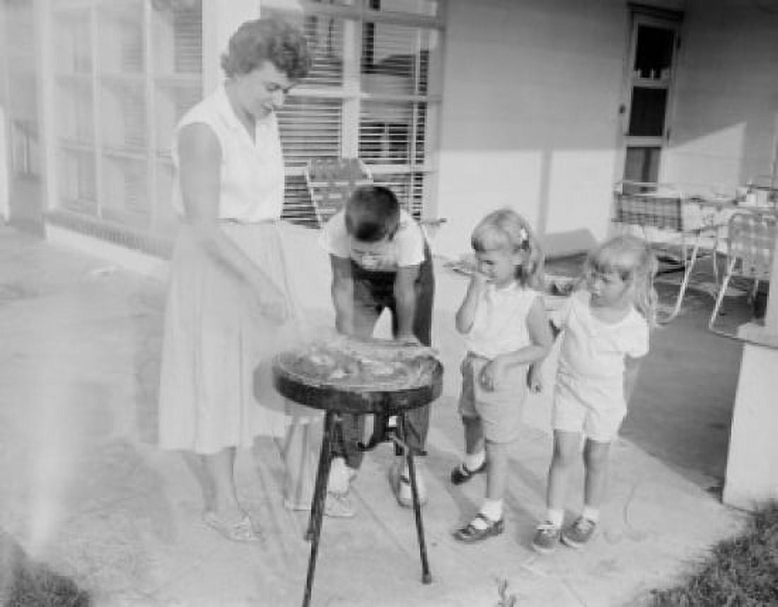 Mother doing barbecue and children watching her Canvas Art - (24 x 36)