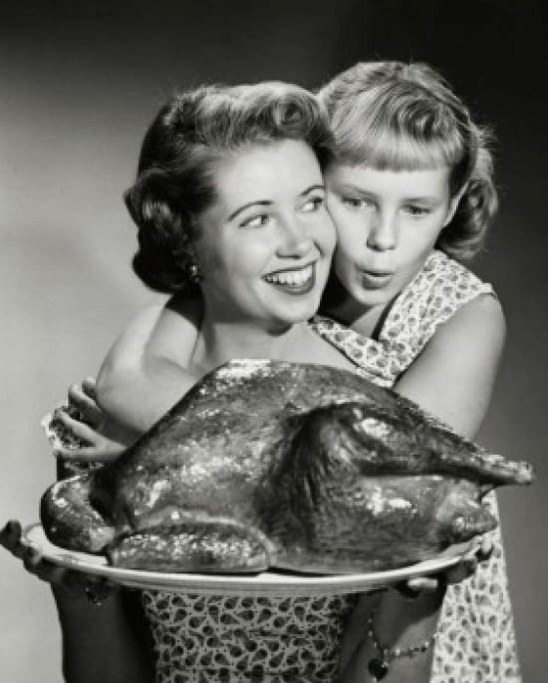 Mother holding a turkey with her daughter hugging her from behind Canvas Art - (18 x 24)