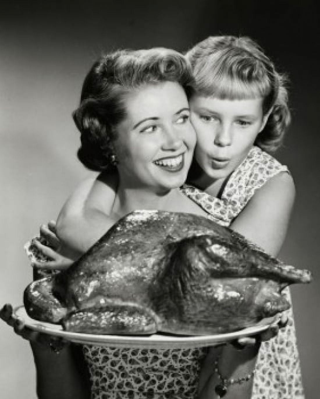 Mother holding a turkey with her daughter hugging her from behind Canvas Art - (24 x 36)