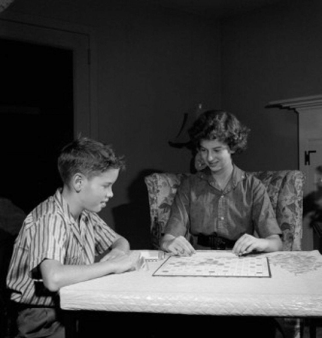 Mother playing scrabble with son in home Canvas Art -  (24 x 36)