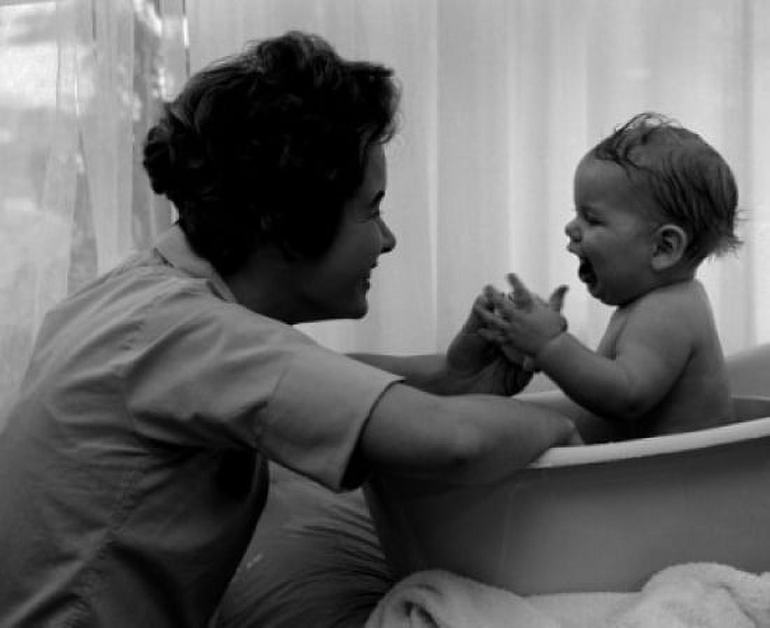Mother playing with baby in baby bathtub Canvas Art - (18 x 24)