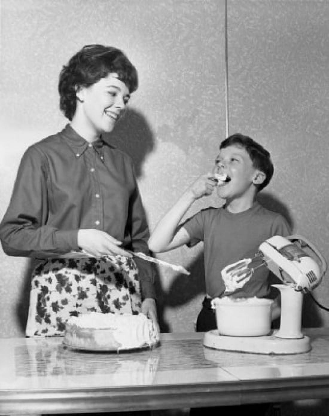 Mother preparing a cake with her son Canvas Art - (18 x 24)