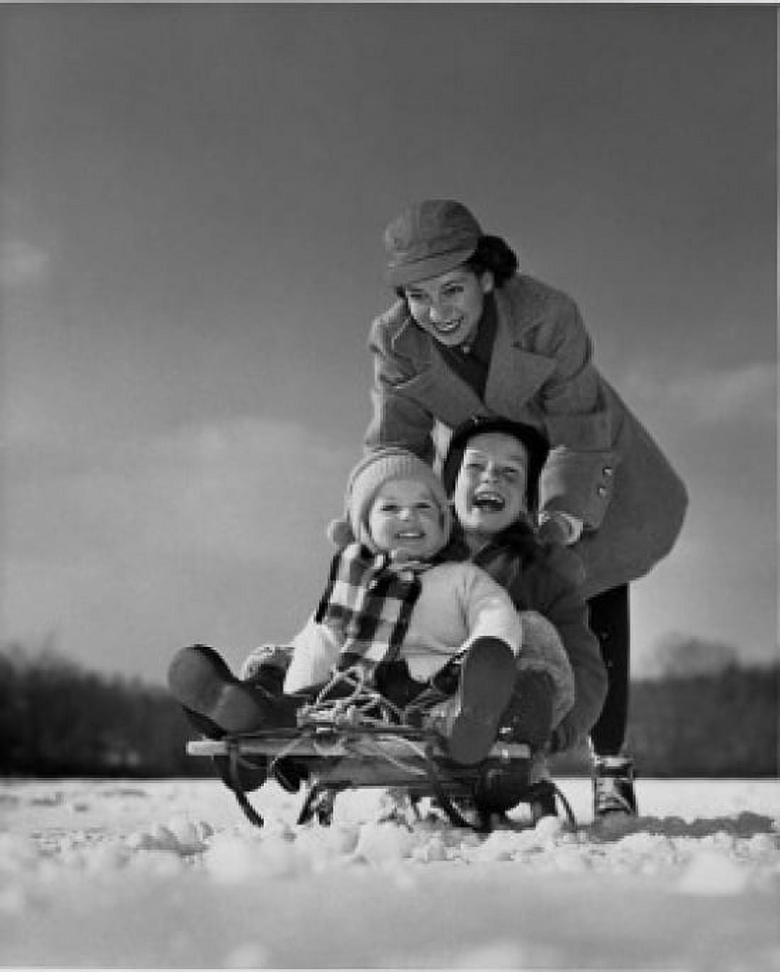 Mother pushing her children on a sled Canvas Art - (24 x 36)