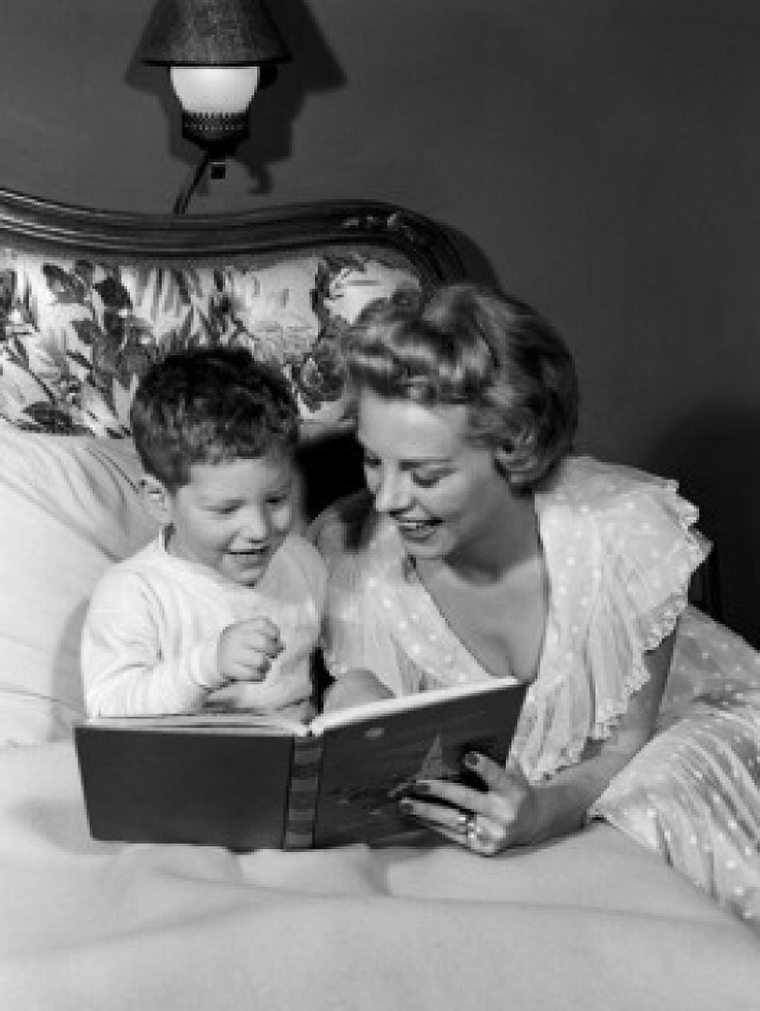 Mother reading to son in bed Canvas Art - (24 x 36)