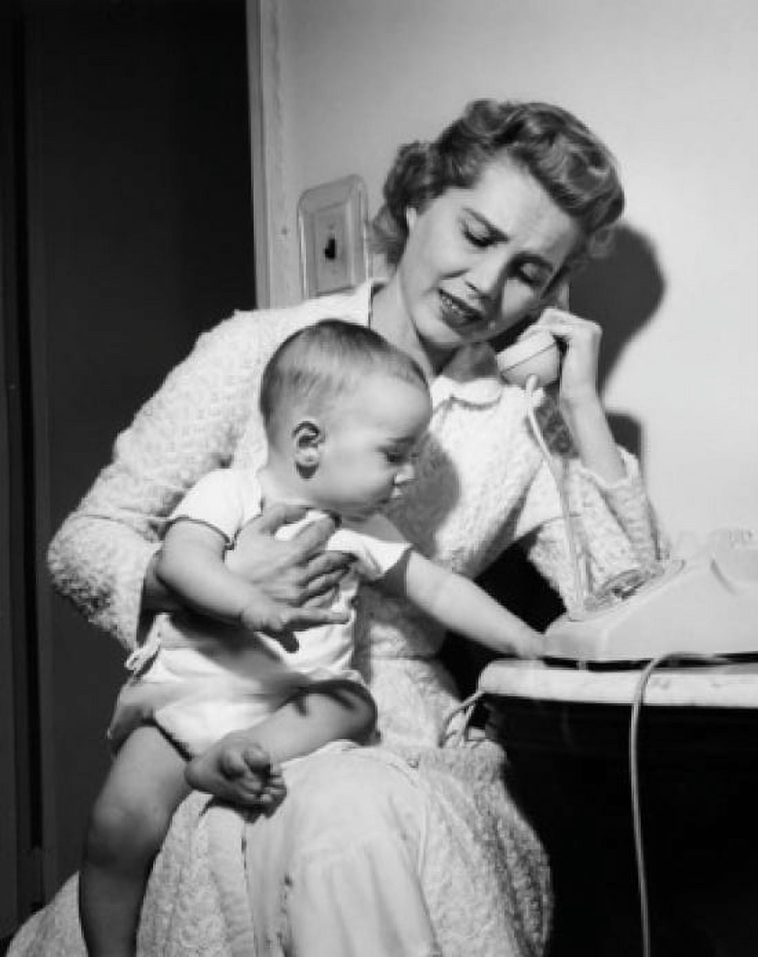 Mother with baby boy on laps talking on phone Canvas Art - (18 x 24)