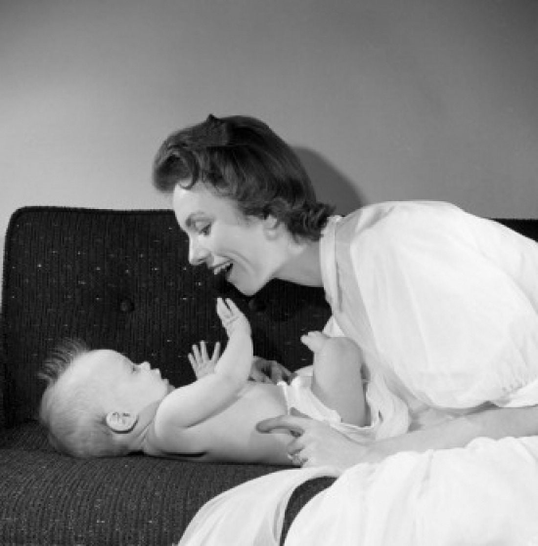 Mother with baby boy on sofa Canvas Art - (18 x 24)