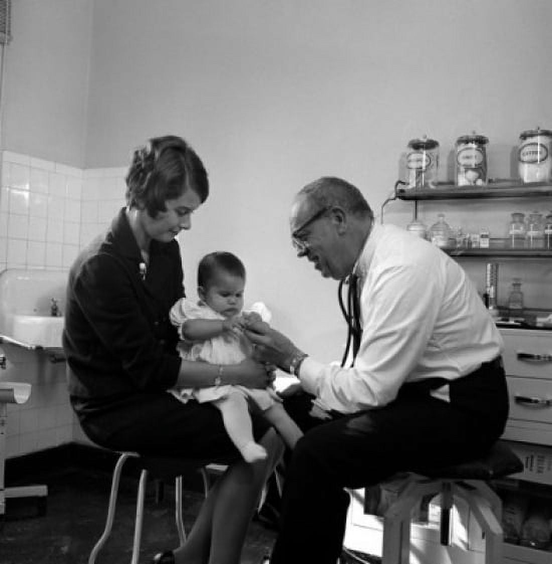 Mother with baby girl in doctors office Canvas Art - (24 x 36)