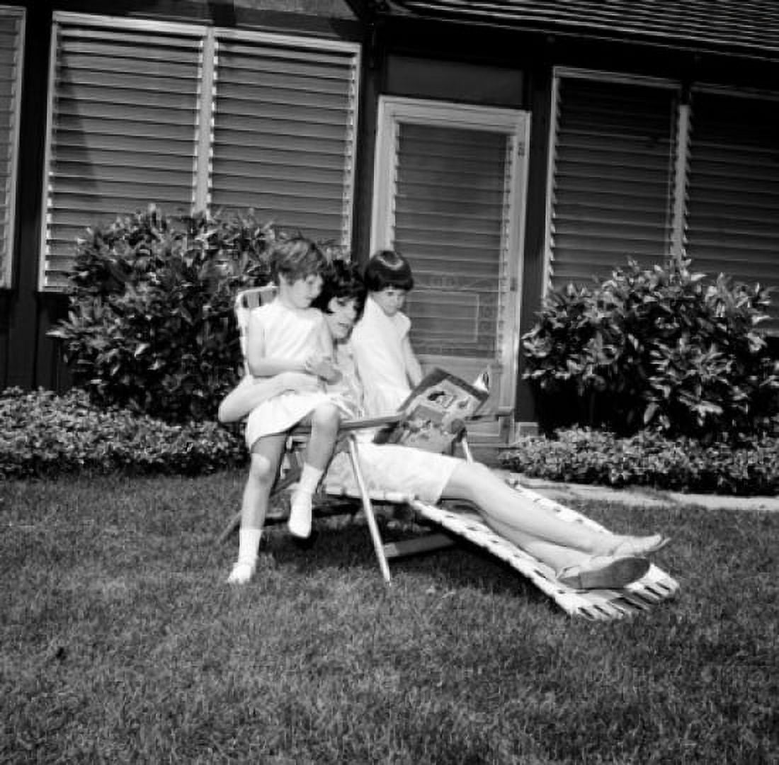 Mother with children reading in garden Canvas Art - (18 x 24)