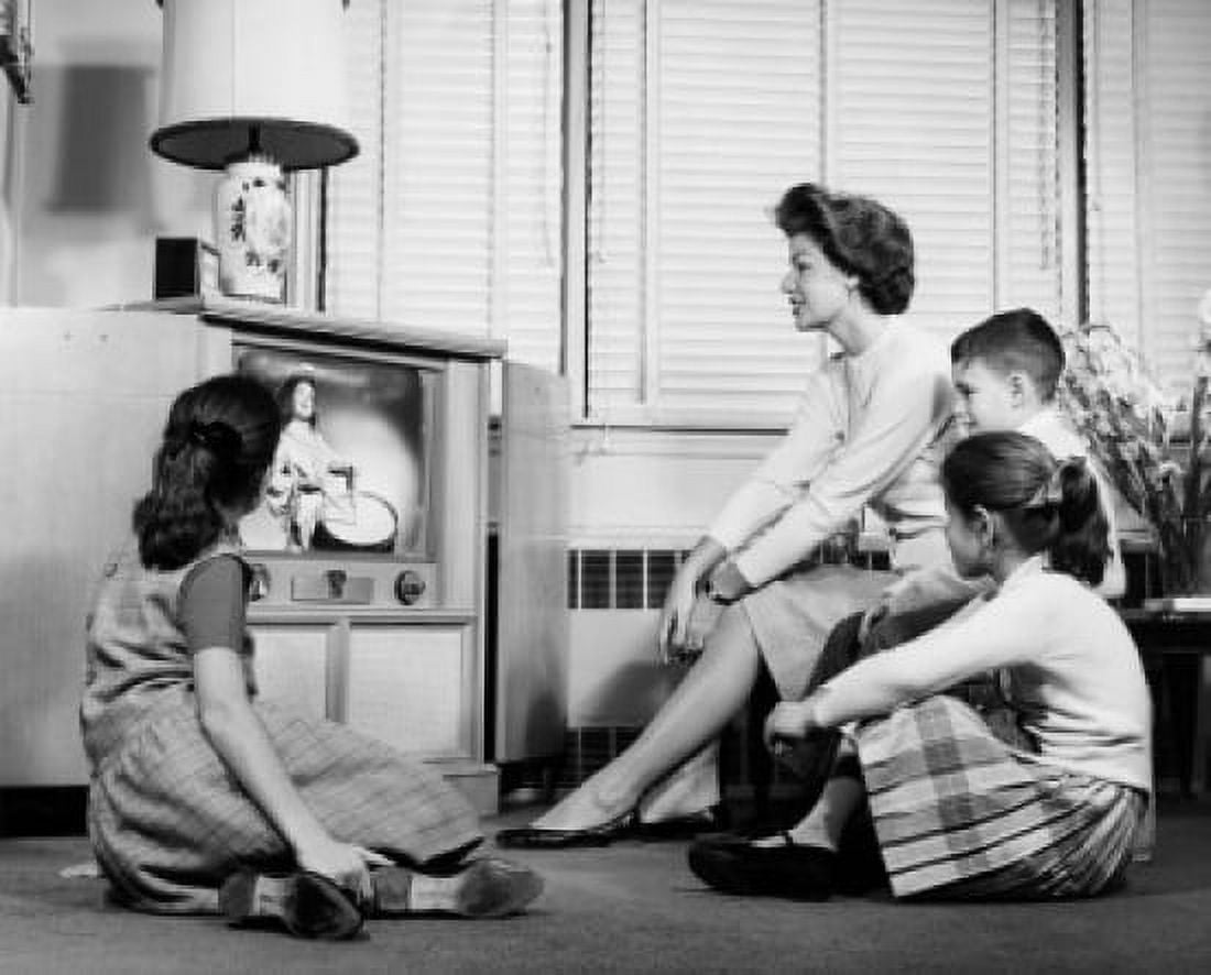 Mother with her three children watching television Canvas Art - (24 x 36)