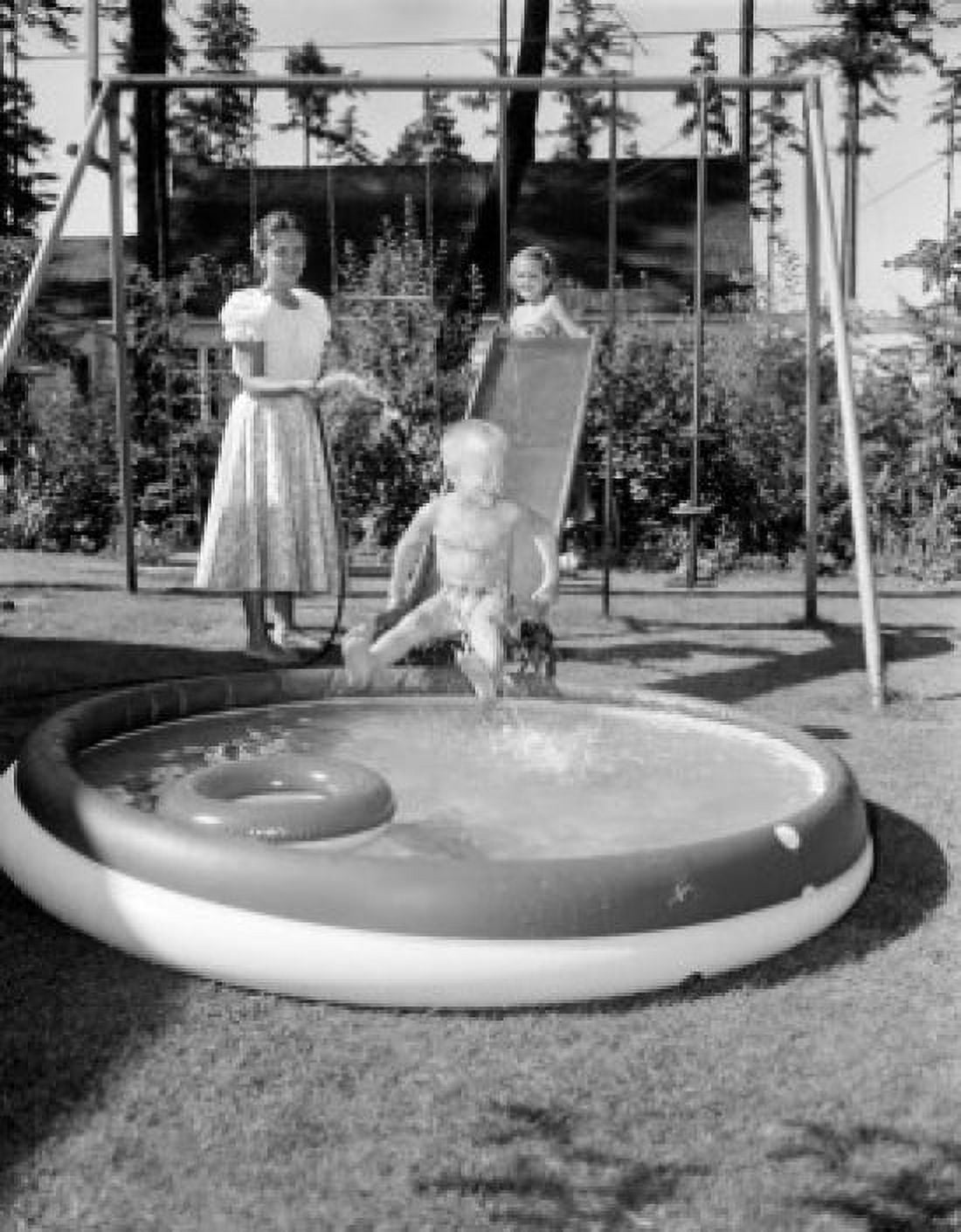 Mother with two children who sliding into wading pool Canvas Art - (18 x 24)