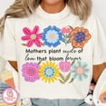 thumbnail image 1 of Mothers Plant Seeds of Love T-Shirt, Floral Mama Quote Tee, She Is Mom Graphic Shirt, Mother’s Day Gift for Women, 1 of 5