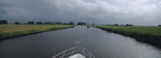 Motorboat in a canal Friesland Netherlands Canvas Art - Panoramic Images (36 x 13)