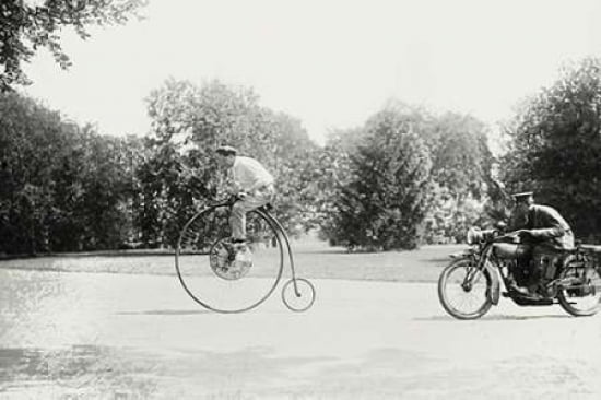 Motorcycle cop chases a Penny Farthing Velocipede Canvas Art - Unknown (24 x 36)