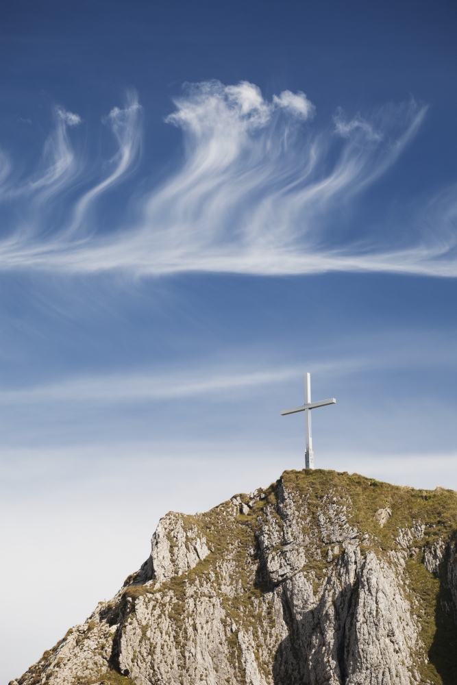 Mountain Peak With A Cross On Top Against A Blue Sky With Clouds Fussen Germany Canvas Art - Michael Interisano Design Pics (12 x 19)