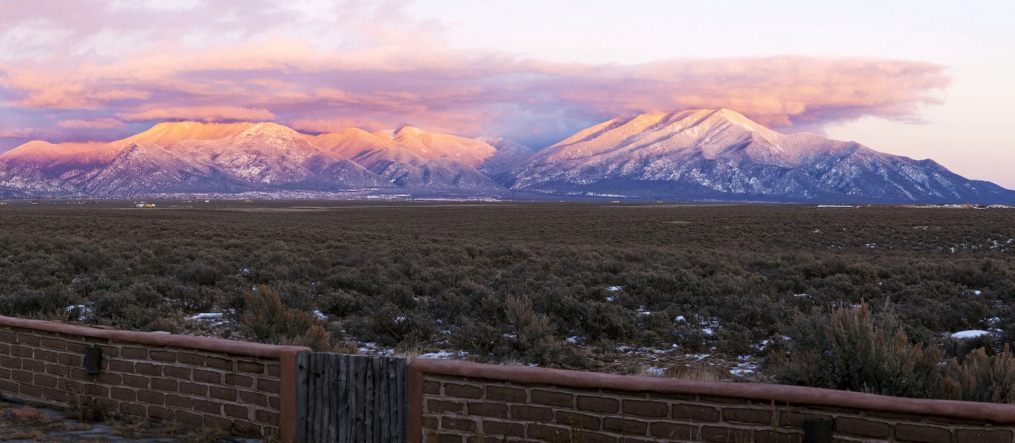 Mountain range viewed from a Adobe brick wall and Sangre De Cristo Mountains New Mexico USA Canvas Art - Panoramic Images (27 x 9)