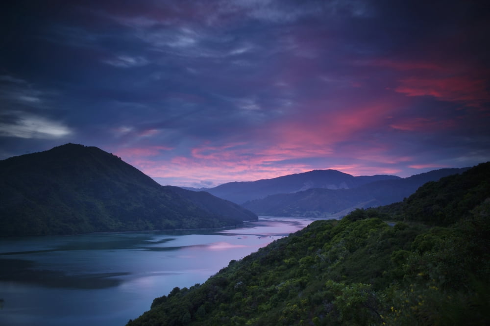 Mountains Along The Coastline Under A Red Sky At Sunset Havelock South Island New Zealand Canvas Art - David DuChemin Design Pics (19 x 12)
