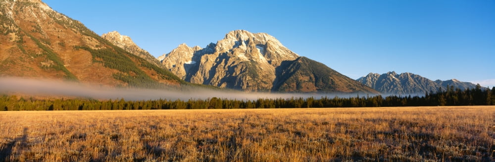 Mountains surrounded with fog Mt Moran Grand Teton National Park Wyoming USA Canvas Art - Panoramic Images (6 x 18)