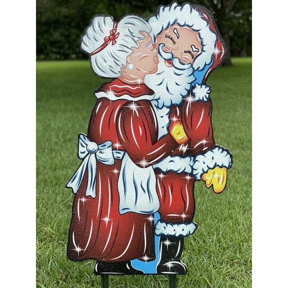 Mrs. Claus kissing Santa