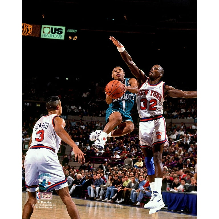 Muggsy Bogues Charlotte Hornets Unsigned Teal Jersey Mid Air vs. New York Knicks Photograph
