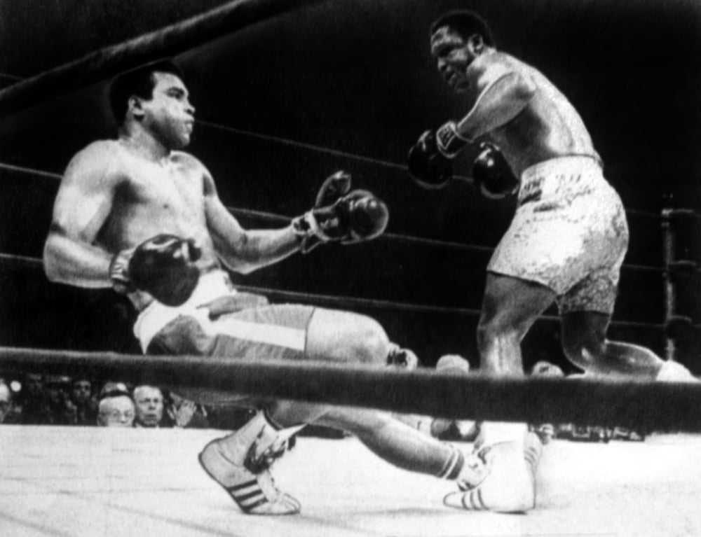 Muhammad Ali Knocked Down By Joe Frazier In Their First Title Match In