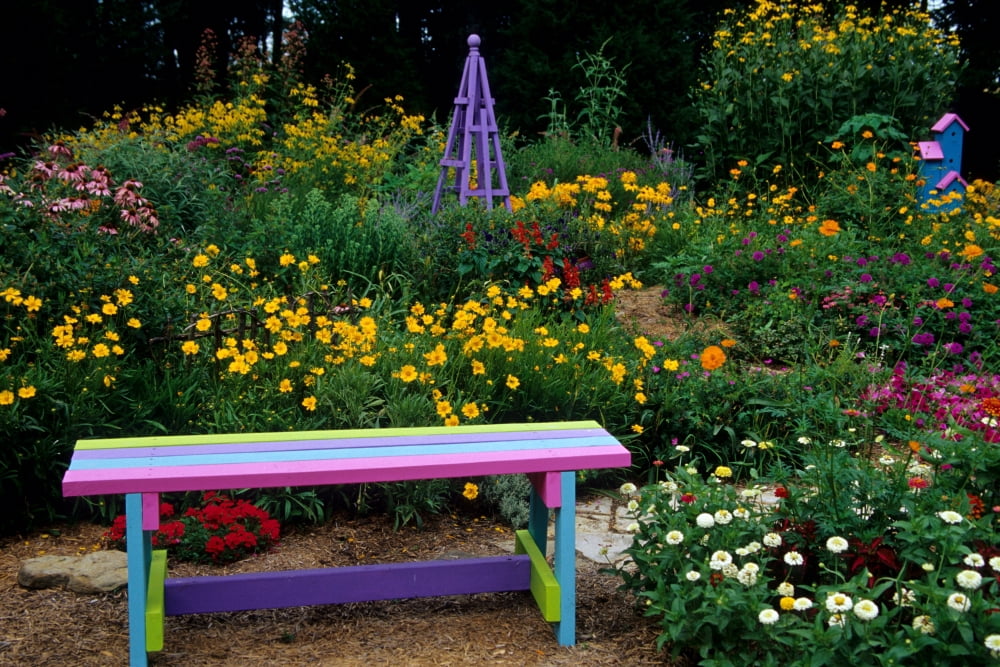 Multi-colored bench obelisk and birdhouse in a flower garden Marion County Illinois USA Canvas Art - Panoramic Images (18 x 24)