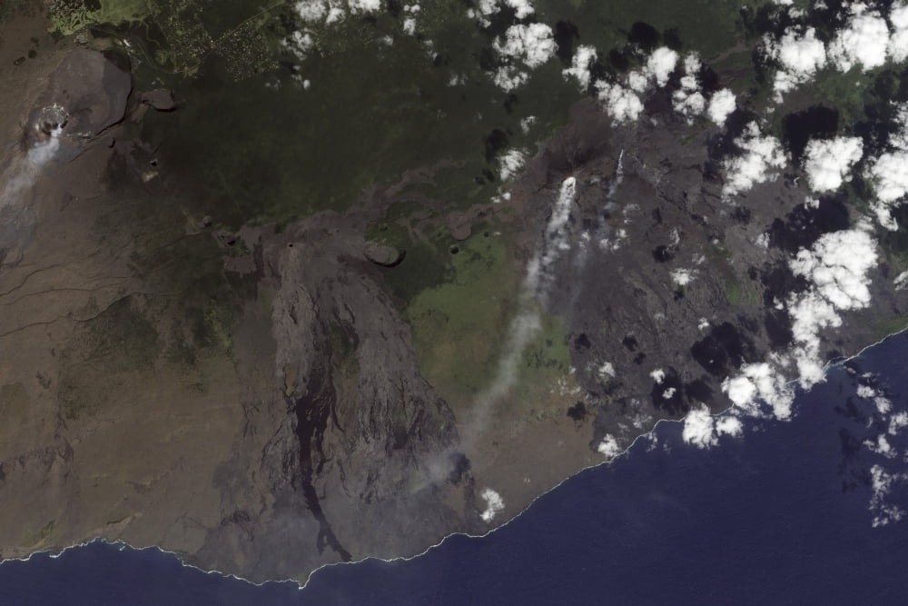 Multiple plumes blow toward the south-southwest from Kilauea in the Hawaiian Islands Canvas Art - Stocktrek Images (34 x 23)