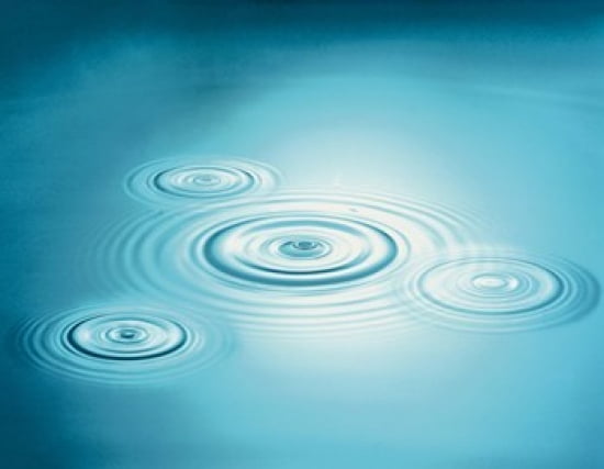 Multiple rings in blue water with bright light reflection Canvas Art - Panoramic Images (24 x 19)