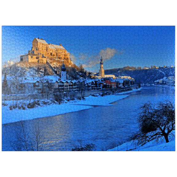 MyPuzzle - View Over The Salzach River To The Old Town With Castle, Heilig-Geist-Kirche And Parish Church St. Jakob In The Morning Light, Burghausen - Premium 1000 Piece Jigsaw Puzzle for Adults