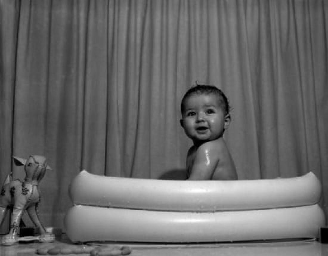 Naked baby sitting in wading pool Canvas Art - (18 x 24)