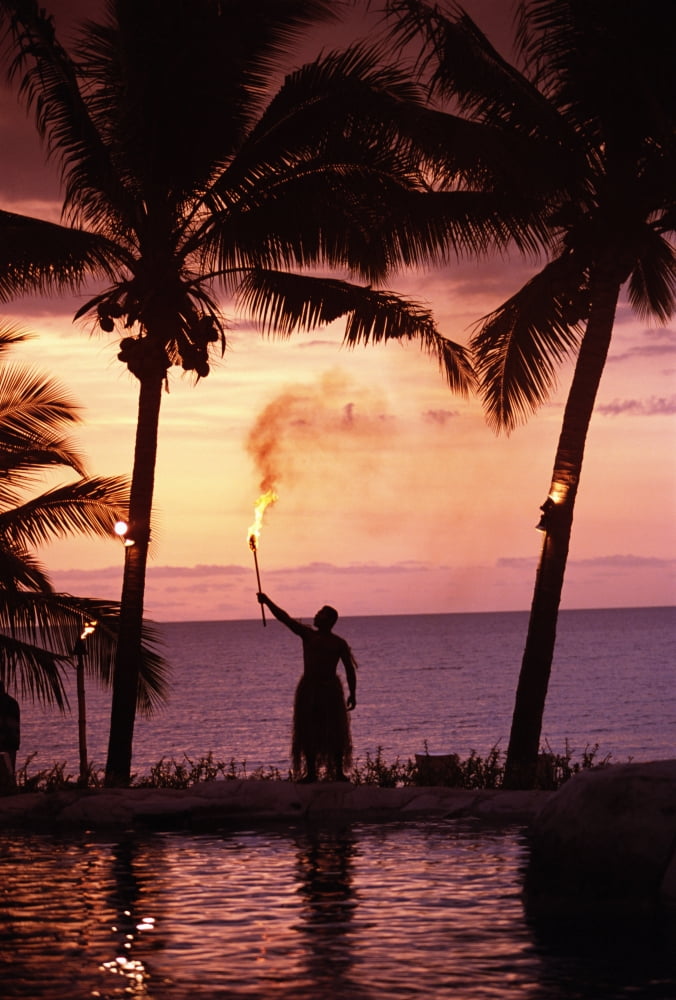 Native In A Grass Skirt Holding A Flaming Torch By Coast At Sunset Canvas Art - Chris Parker Design Pics (11 x 17)