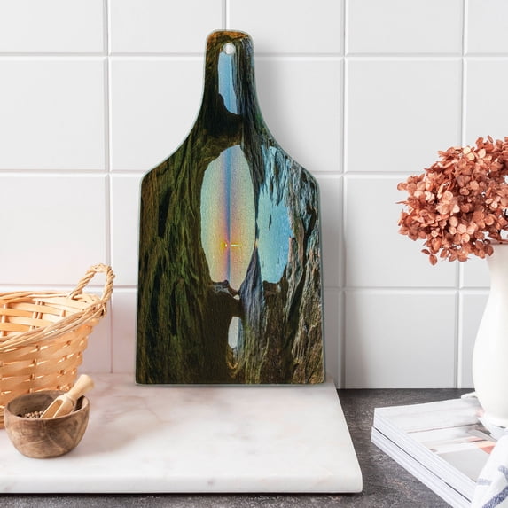 Natural Cave Cutting Board, Horizon View from Mossy Invisible Big Grotto by the Sea up Rocks Photo, Decorative Tempered Glass Cutting and Serving Board, Wine Bottle Shape, Green Blue, by Ambesonne