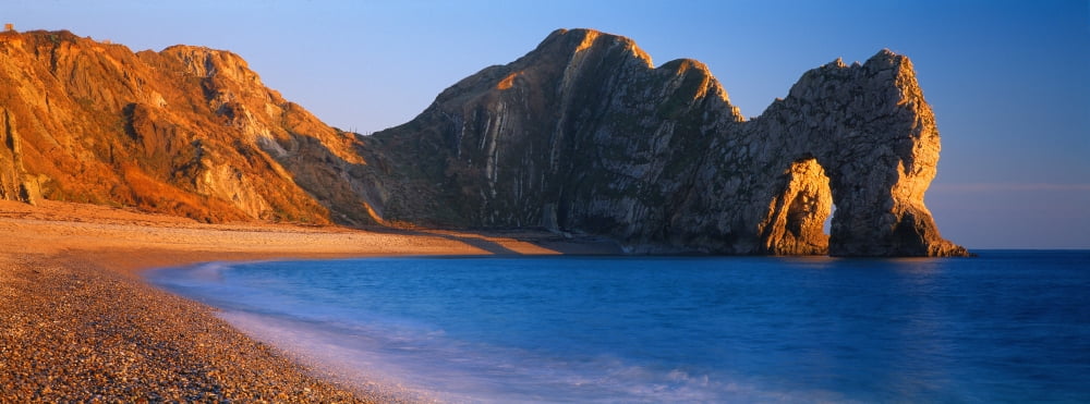 Natural arch on the beach Durdle Door Dorset England Canvas Art - Panoramic Images (27 x 9)