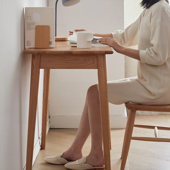 Natural wood dressing table with solid oak, a large storage drawer, grey fabric top, and rounded corners for safety.