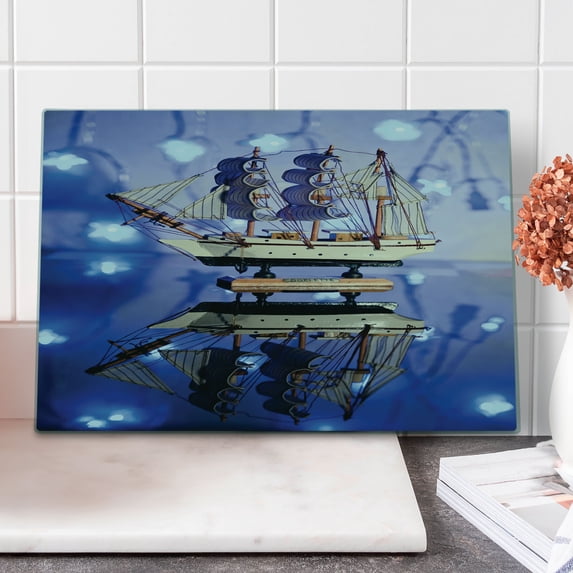 Nautical Cutting Board, Close up Photo Model of a Ship with Sails on Blurry Background Maritime Themed, Decorative Tempered Glass Cutting and Serving Board, in 3 Sizes, by Ambesonne